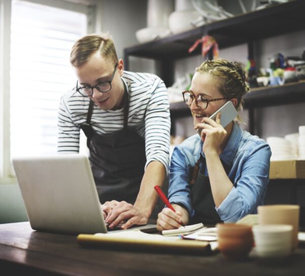 Financial Adviser Perth - Couple managing small business together showing teamwork and strategic planning