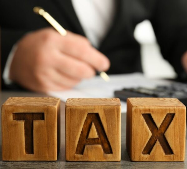 Financial Adviser Perth - Man calculating tax showing strategy and financial structure
