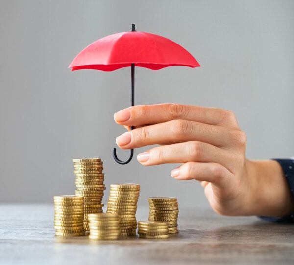 Financial Adviser Perth - Umbrella covering coins showing protection and financial security